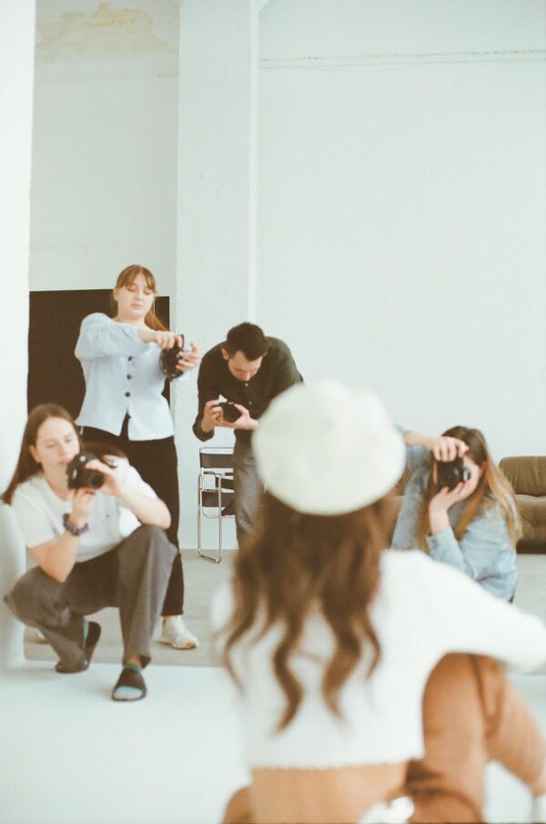 Group of photographers captures model during a studio session in Toronto.